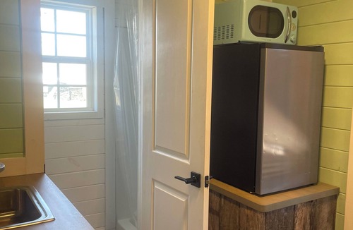 Tellico Plains Cabin | This unique tiny home has its own private pickleball court!