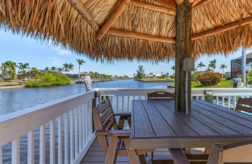 Pelican Villa | This Villa has it all! Waterfront - heated pool, hot tub, boat dock, tiki hut!