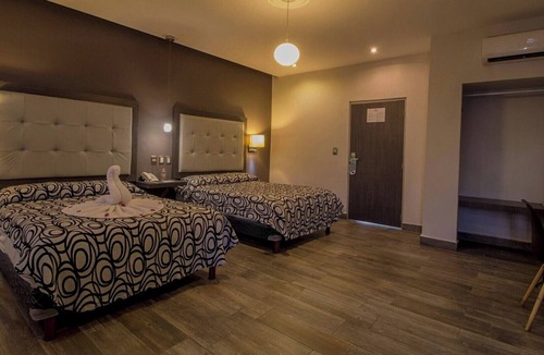 Centro Hotel | Three Comfortable and Airy Rooms with Easy Access to Beach & Local Fun