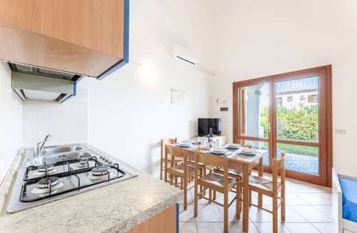 Budoni Apartment | Three-room apartment 6/7 beds, two bathrooms, 43/50 sqm c. To. Arranged on two levels: on the ground floor equipped patio, living room with equipped kitchenette and double sofa bed, bedroom with bunk bed, bathroom. On the first floor double b