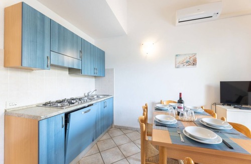Budoni Apartment | Three-room apartment 6/7 beds, two bathrooms, 43/50 sqm c. To. Arranged on two levels: on the ground floor equipped patio, living room with equipped kitchenette and double sofa bed, bedroom with bunk bed, bathroom. On the first floor double b