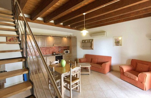 Santa Maria La Palma Apartment | Three-room apartment of 60 square meters, at ground floor and arranged on two levels. Comprising a living room with a sofa bed for two people, a fully equipped kitchenette. Two bedrooms and a bathroom with shower upstair.Splendid terrace with a view, ide