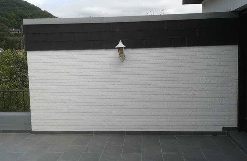 Hasenfeld House | Three-storey house with sauna, fireplace room and two terraces