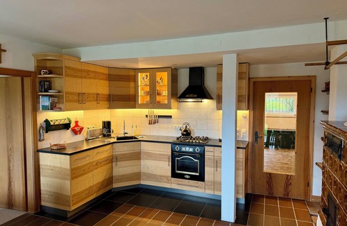 Kochel am See Apartment | Time out at Walchensee with garden, lake view & sauna