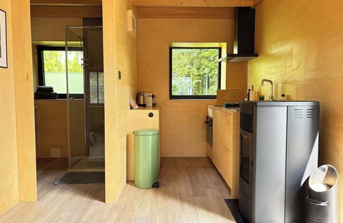 Groede Cabin | Tiny house with fireplace in polder | Tiny House Wood
