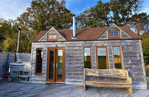 Maidwell Cabin | Tinywood Three, dog friendly with hot tub, sleeps up to eight people in Warwick