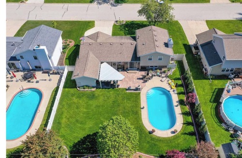 Ashwaubenon House | Titletown Gem: Steps to Lambeau, Heated Pool, Hot Tub & Entertainment HQ