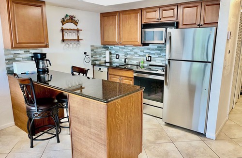 Vanderbilt Beach Condo | TOP FLOOR BAY VIEW, ROOFTOP POOL, STEPS TO VANDERBILT BEACH!