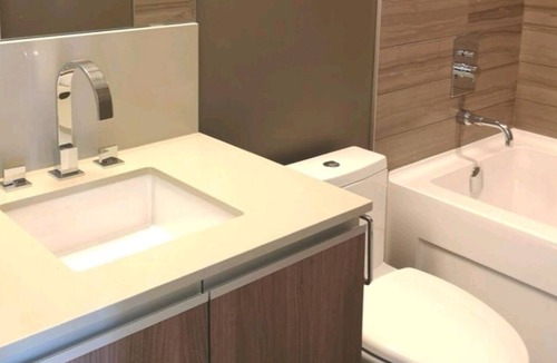 Panorama Hills Apartment | Top floor condo that is your ideal stay for Stampede