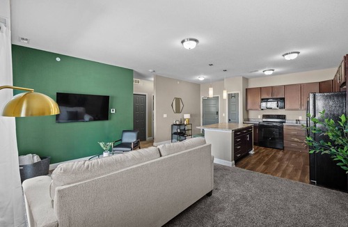 West Des Moines Apartment | Top Floor, Modern Suite with Balcony Pool Views