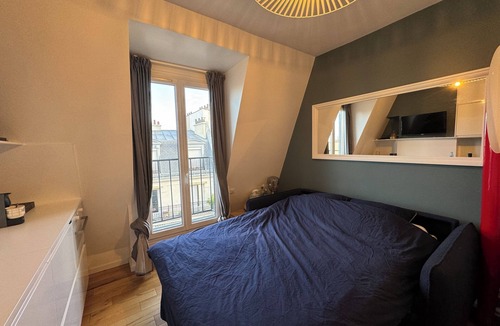 Chaillot Apartment | Top floor Paris studio - view of rooftops and monuments