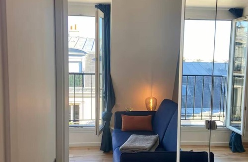 Chaillot Apartment | Top floor Paris studio - view of rooftops and monuments