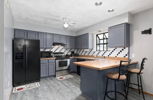 Swansea House | Touch of Class 3-bedroom townhome in Belleville King Bedroom.