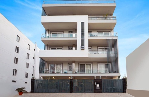 Sushant Lok Apartment | Tranquil 2BR Oasis with Balcony & Bathtub
