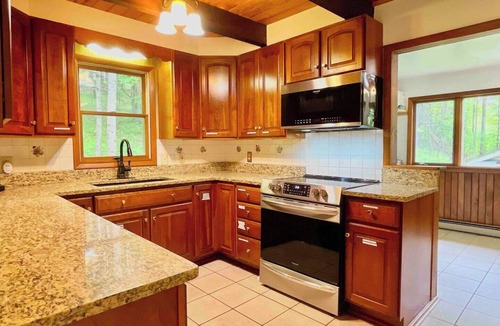 Oneonta House | Tranquil cottage retreat with screened porch, campfire, and cozy living spaces. Perfectly located near Cooperstown and Oneonta. Sleeps 6.