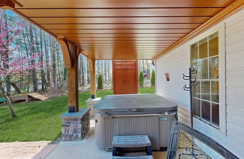 Bumpass House | Tranquil lakefront retreat with hot tub, screened porch, kayaks, and more