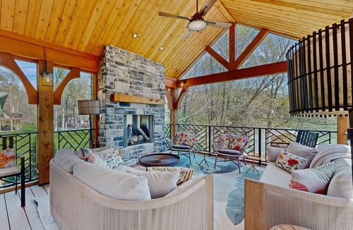 Bumpass House | Tranquil lakefront retreat with hot tub, screened porch, kayaks, and more