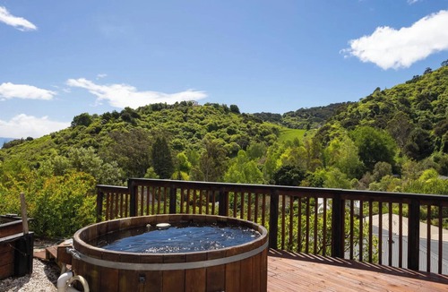 Atawhai Apartment | Tranquil Nelson Escape: Birdsong, Hot Tub, Parking. One bedroom, living room.
