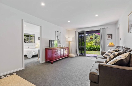 Atawhai Apartment | Tranquil Nelson Escape: Birdsong, Hot Tub, Parking. One bedroom, living room.