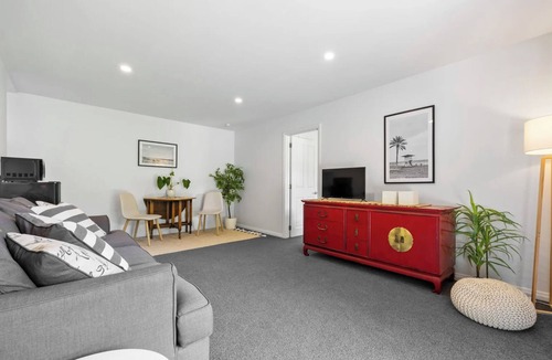 Atawhai Apartment | Tranquil Nelson Escape: Birdsong, Hot Tub, Parking. One bedroom, living room.