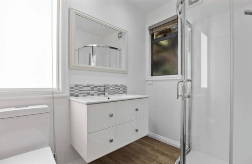 Atawhai Apartment | Tranquil Nelson Escape: Birdsong, Hot Tub, Parking. One bedroom, living room.