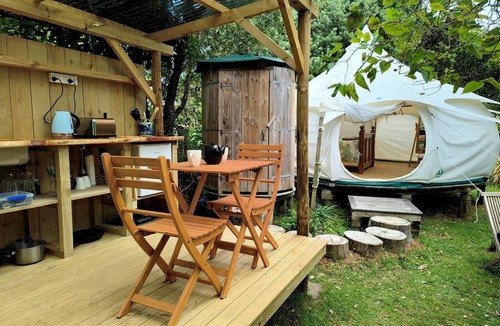 Oneroa RV Rental | Tranquil Pondside Glamping with Outdoor Kitchen near Wildlife Haven in Waiheke Island, NZ