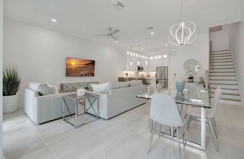 Stuart House | Tranquil Waters New Waterfront Townhome - Boat slip with lift included.