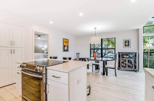 Longbeach Village House | Tree-lined home w/amazing decor & screened porch - near beach/dining