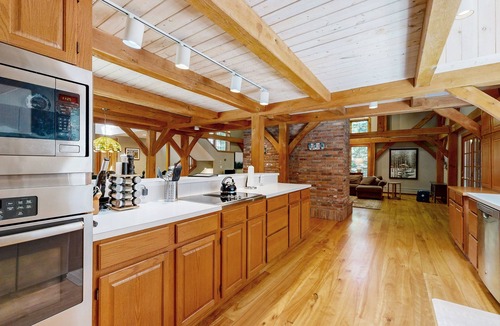 Londonderry House | Tree-lined lodge with deck, fireplaces, porch, game room, & fast WiFi