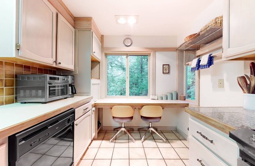 Burley House | Tree-lined retreat with wood fireplace, board game collection, & pool access