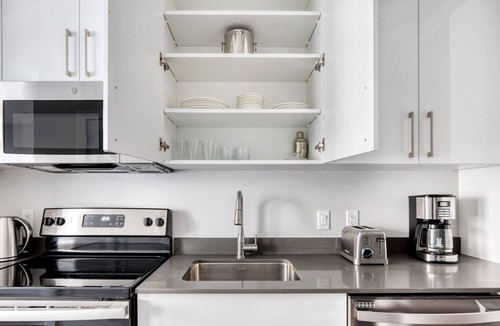 St. Elizabeth's Apartment | Trendy Brighton Studio w/W/D, Gym, near T, Shops + Dining, by Blueground