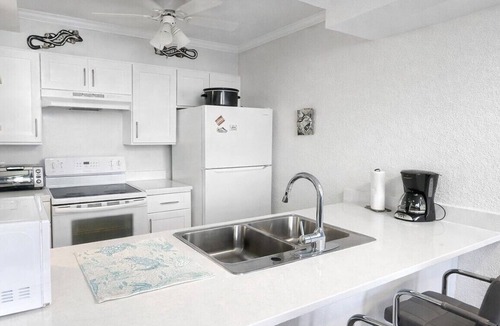 Williams Town Condo | Tropical Oasis: Ocean View ~ Pool & Bar ~ Family-Friendly