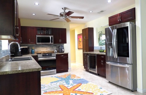 Singer Island House | Tropical Paradise Home Steps to Beach Heated Pool Game Rm Singer Island Retreat!