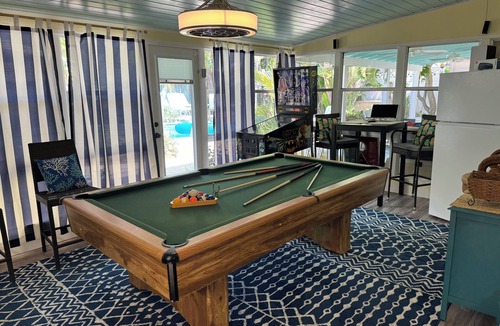 Singer Island House | Tropical Paradise Home Steps to Beach Heated Pool Game Rm Singer Island Retreat!