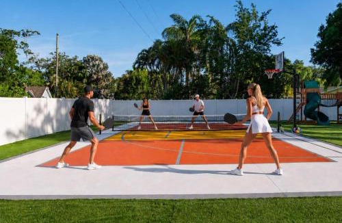 Clearwater House | Tropical pop art getaway w Pool & Game Room