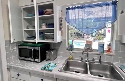 Hawks Park House | Tropical Riverside Oasis with Private Pool Near drive-on beach & river access