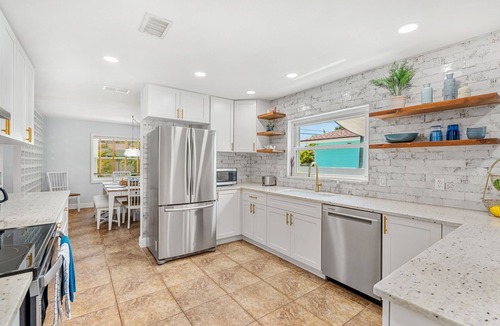 Seacoast Shores House | Tropical Retreat: Indian Harbour Beach Home with BBQ Grill, Fire Pit, Private Pool & Hot Tub! 🌴