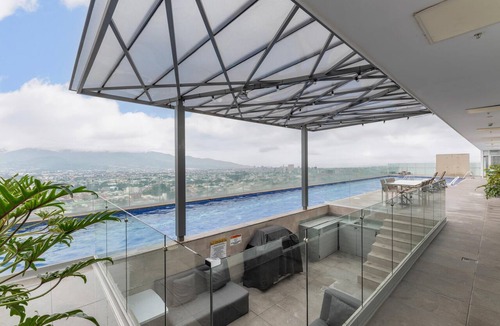 San Pedro Apartment | Tropical Vista iFreses, 2nd floor! AC, TV and Pool