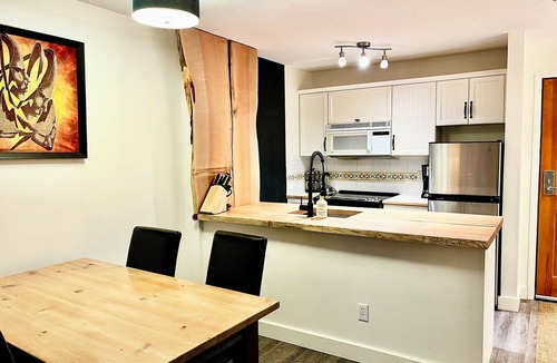 Upper Village Condo | True ski in/ski out, outdoor hot tubs & well-equipped kitchen. Balcony! bbq!