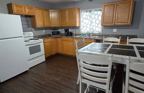 Monticello Cabin | Two Bedroom Cabin - "The Big One" - This spacious cabin gets it's name honestly! Cabin is 800 sq ft with two-bedrooms feature three (3) queen beds, one (1) full size bed, and two (2) futons allow for a max of twelve (12) people. Conveniently located