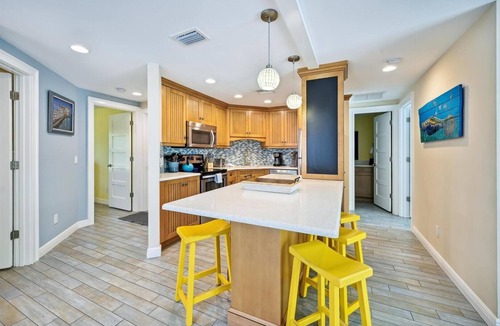 Holmes Beach Cottage | Two Bedroom Ground Floor Island Home Sleeps 5 and Includes Heated Pool.