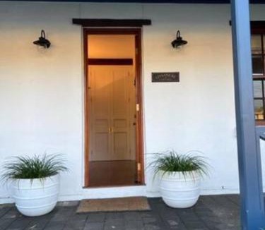 Grange House | Two roomed private suite in front of cottage