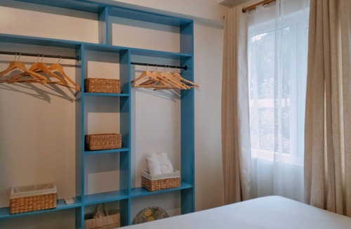 Guadalupe Apartment | Two separate studio units on the same floor of a midrise condominium building.