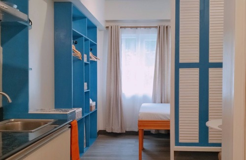 Guadalupe Apartment | Two separate studio units on the same floor of a midrise condominium building.