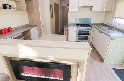 Ferryside Cottage | UNDER CLIFF CARAVAN, family friendly, with pool in Ferryside