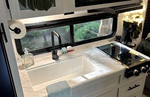Rosston House | Unique Jungle-Style Glamping RV with 8-Foot Suspended Tree Tent near Creek Trails in Forestburg, Texas