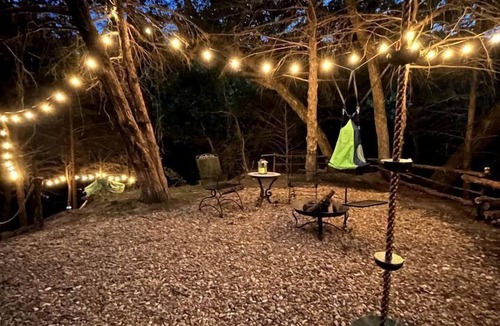 Rosston House | Unique Jungle-Style Glamping RV with 8-Foot Suspended Tree Tent near Creek Trails in Forestburg, Texas
