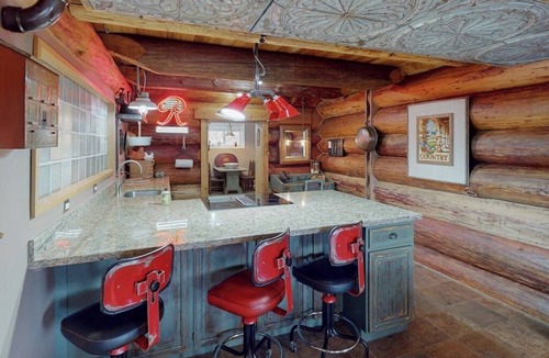Carnation House | Unique mountain view log home with a wood stove, balcony, patio, & board games