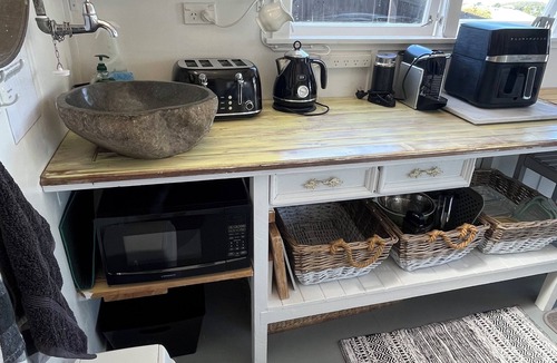 Whitianga Cottage | Unique Tiny homes with fabulous sea views and cosy internal courtyard.