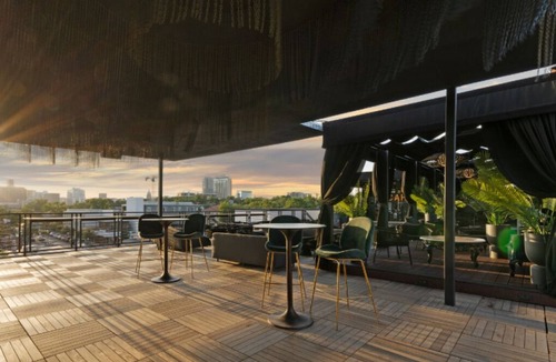 East Cesar Chavez House | Unit 2+3 Inn Cahoots on 6th: 10BR/26 Bed - Pool, Roofdeck, Garden Bars, Walk To Everything!